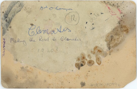 Card backing of a photograph, with some handwritten text.
