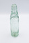 Empty glass bottle with Codd Neck design.
