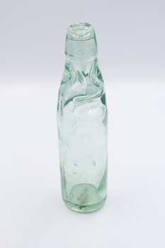 Empty glass bottle with Codd Neck design.