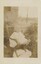 Black and white photo of Jack Nobelius at 12 months old, sitting in a garden printed on to card.