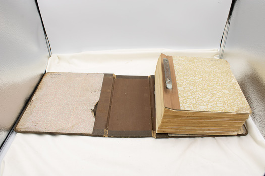 Manual open to outer cover, revealing inner cover and pattern on inside edge of outer cover