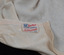 A tag affixed to fabric.