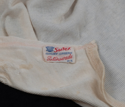 A tag affixed to fabric.