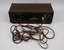 Back of amplifier with a mass of electrical cords in foreground.