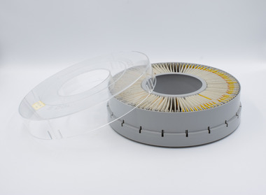Rotary slide magazine with clear plastic lid removed