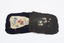 Back of hospital badge laid out showing some wear