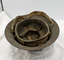 Underside of tin helmet showing name label and strap.