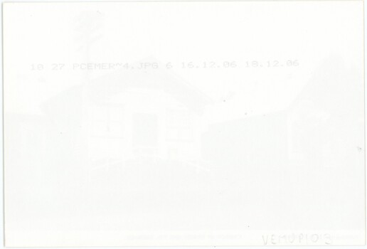 The reverse of a printed photograph, with digital photograph details in printed text.