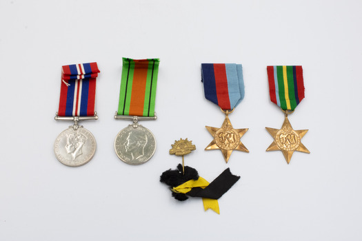 The obverses (face or front side) of the five medals detailed in this entry, arranged left-to-right a, b, c, d, e.