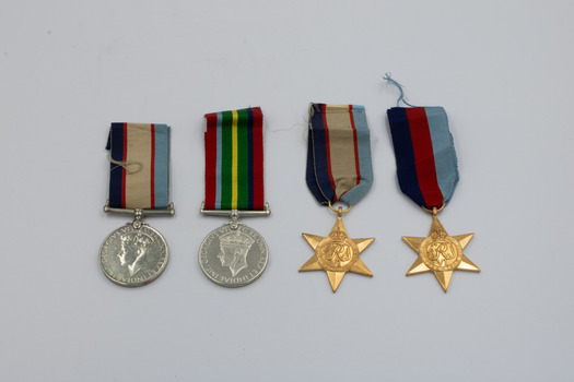 The obverses (face or front side) of the four medals detailed in this entry, arranged left-to-right a, b, c, d.