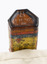 Underneath medicine bottle showing manufacturer marks and partly visible label.