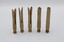 Five wooden clothes pegs positioned upright on their heads