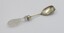 Silver plate salad serving fork with cut glass handle.