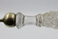 Close-up image of cut glass Chippendale handle of salad serving fork