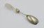 Salad serving fork in prone position with fork end in the foreground.