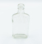 Small glass bottle upright.