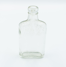 Small glass bottle upright.