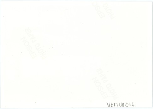 The reverse of a photograph, with a handwritten accession number and corporate logos for the brand of phootgraph paper.