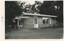 A black and white photograph of a brick building.