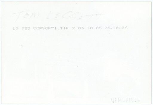 Reverse of an image, featuring handwritten annotation and printed technical information.