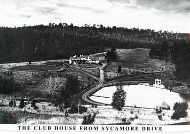 Emerald Country Club club house in centre of image with ornamental lake in the foreground to the right.