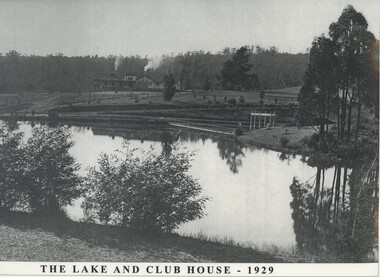 The lake at the Emerald Country Club with the club house in the background.
