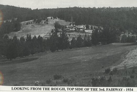Fairway in foreground with the club house in the back ground and environs