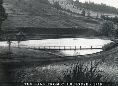 The lake of the Emerald Country Club looking towards the pavillion and Lakeside Drive just behind the lake .