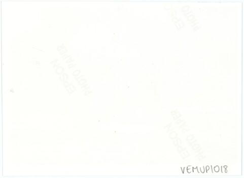 The reverse of a modern printed photograph, with a handwritten accession number and photo paper logos.