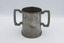 Front of mug, upright, with inscription visible.