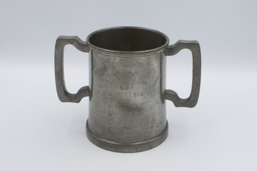 Front of mug, upright, with inscription visible.