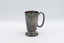 Front of upright cup with inscription visible