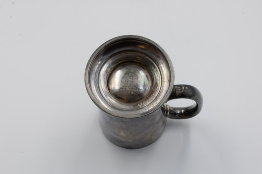 Award cup upside down showing rimmed base with manufacturer marks