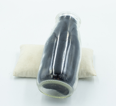 Milk bottle with dark paper inserted in order to make inscription more readable for photograph.