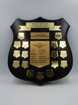 Front of shield with Emerald Golf Club information and the names of the winners of the top qualifier matchplay championship from 2006 to 2013.