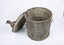 Sanitary can upright with lid resting against can