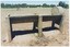 A printed colour photograph depicting a concrete trough from side-on, with a pipe going into the higher right side.