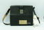 Front of camera case with owner label and airways tag