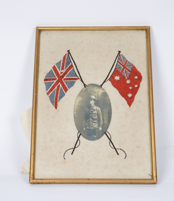 Photograph of soldier in frame including British & Australian flag