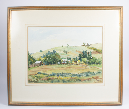 A watercolour painting in a wooden frame, with a white margin.