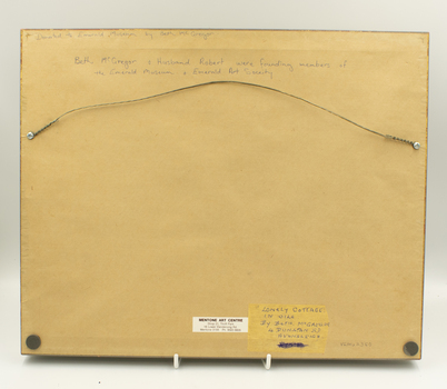 Back of oil painting showing framer's label, information about the painter, and hanging wire.