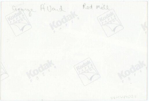 The reverse of a printed photograph featuring handwritten annotations and Kodak logos.