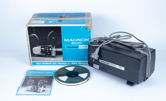 Movie projector with box, insgtruction book and film holder