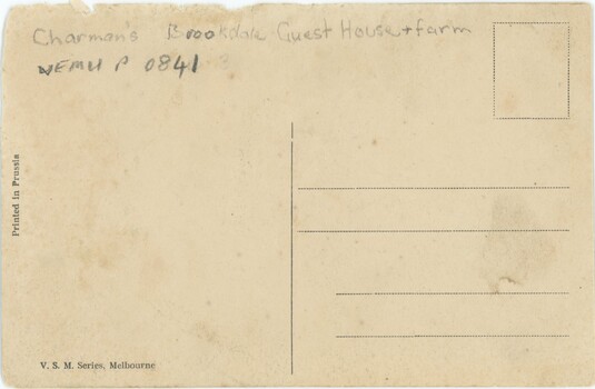 The text-side of a postcard, with no message but some handwritten annotation and printed text.