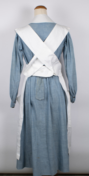 Back view of nurse apron showing crossed straps.
