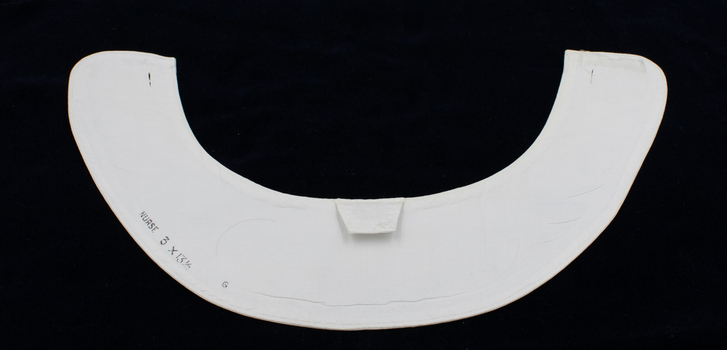 Back of nurse collar (1/2) showing inscription and tag.