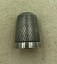 Silver thimble with honeycomb pattern and plain band on the rim.