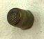 Top view of brass thimble showing spiral pattern.