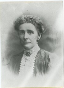 Black and white studio photograph - head and shoulders