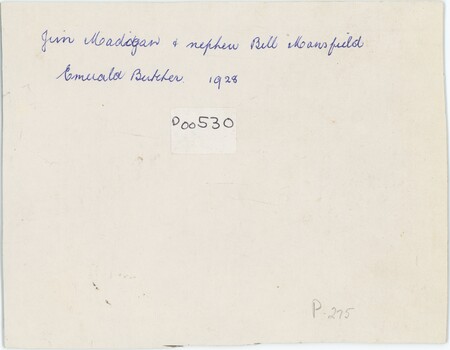 A cream card with handwritten annotation in blue pen.